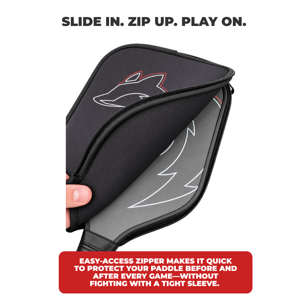 Hand pulling open the zipper of the Slash paddle cover to slide a paddle in